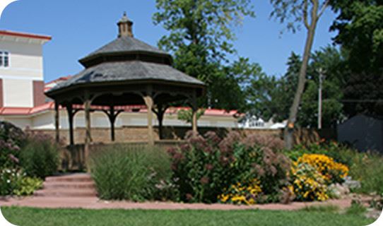 A gazebo surrounded by flowers